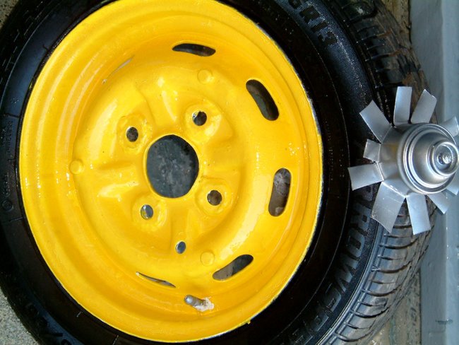 A couple of Spare wheels I modified as get you home wheels in an emergency  13 inch rims I found in a rubbish Skip then cleaned and repainted them.
